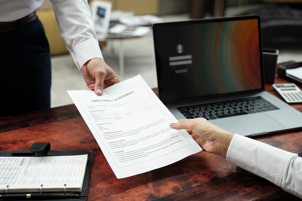 high-angle-hands-holding-document_23-2149445755
